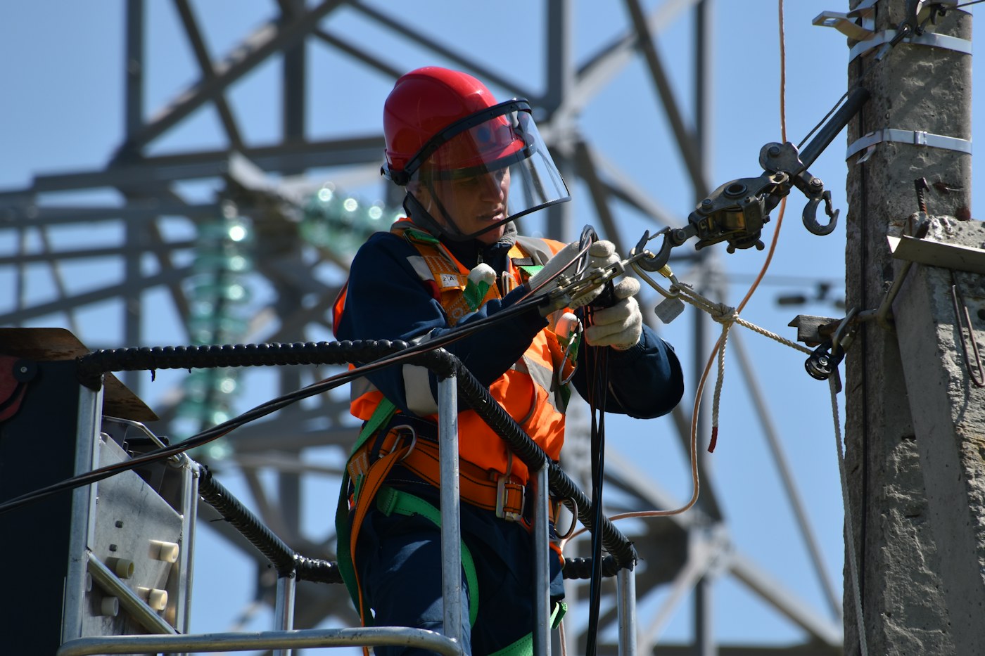 Electrician working on industrial electrical systems
